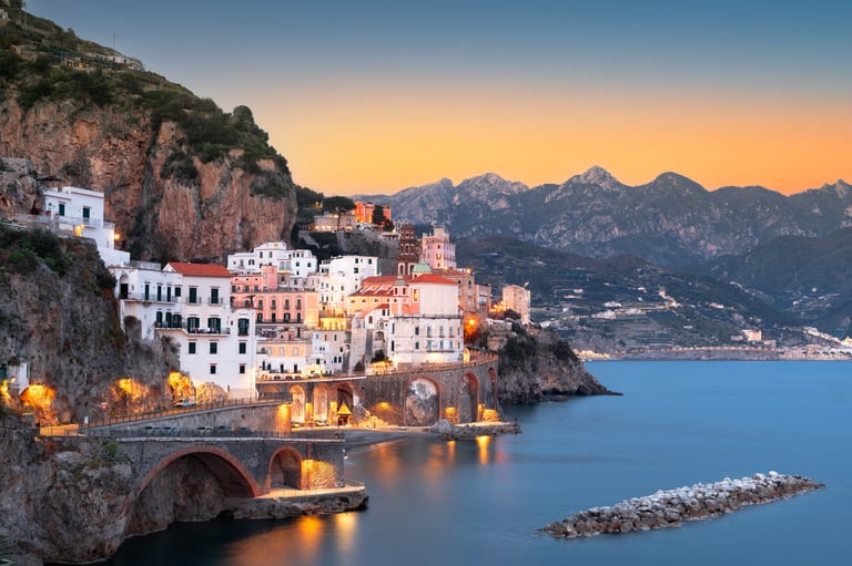 Atrani, Italy along the Amalfi Coast at dusk.